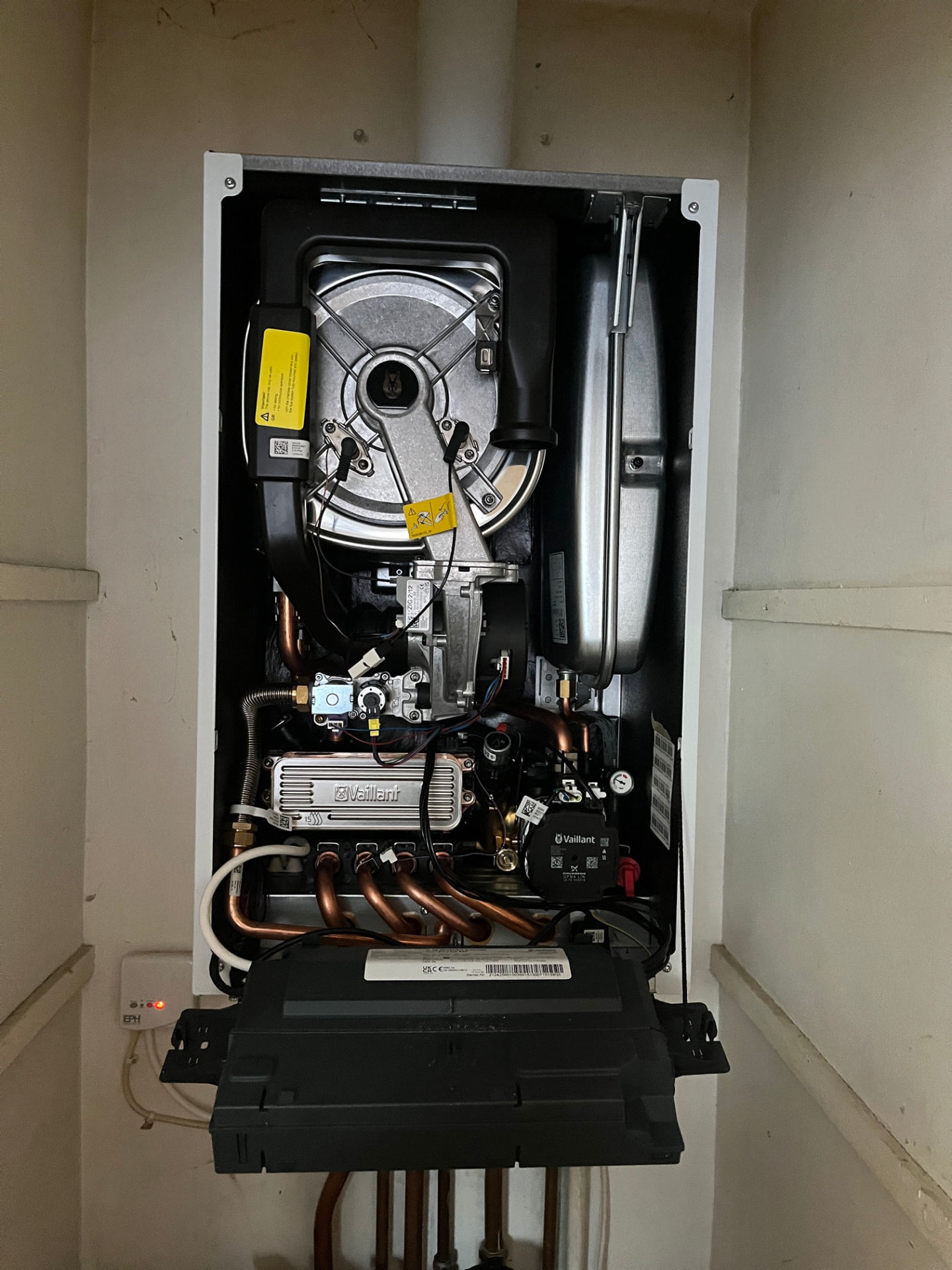 Vaillant boiler opened up for inspection during an annual boiler service